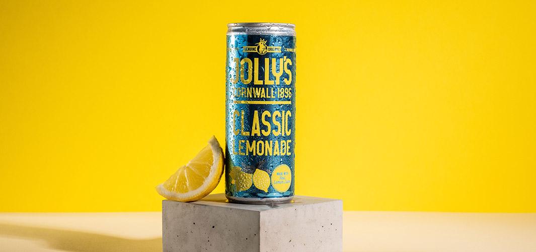 Jollys lemonade on stone plinth with yellow wall background